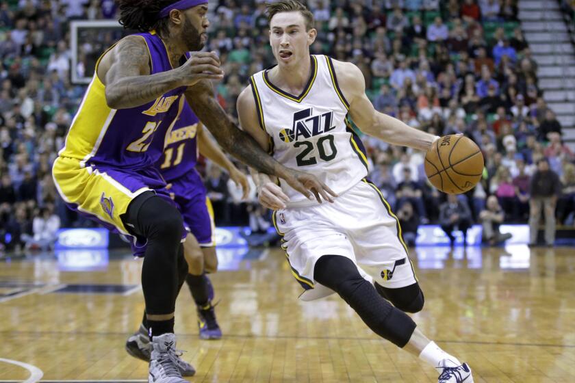 Lakers center Jordan Hill guards Utah Jazz forward Gordon Hayward during a game Feb. 25 in Salt Lake City.