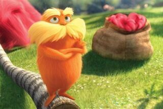 In this film image released by Universal Pictures, animated character Lorax, voiced by Danny Devito, is shown in a scene from "Dr. Seuss' The Lorax." (AP Photo/Universal Pictures)