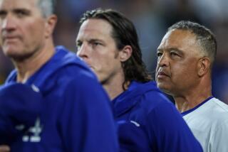 Los Angeles, CA, Tuesday, September 24, 2024 - Dodgers manager Dave Roberts during the national anthem before a game against the San Diego Padres at Dodger Stadium. (Robert Gauthier/Los Angeles Times)