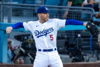 Los Angeles, CA - July 05: Dodgers first baseman Freddie Freeman #5 throws the ball.