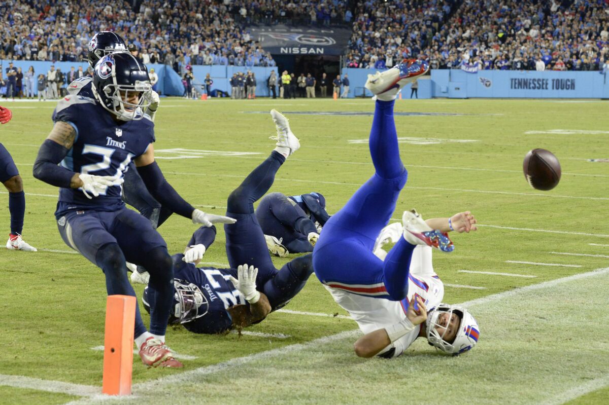 Buffalo Bills quarterback Josh Allen is stopped short of the goal line by Tennessee Titans safety Amani Hooker.