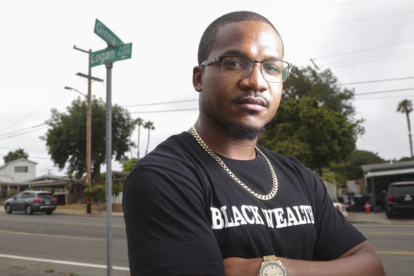 SAN DIEGO, CA - JUNE 16: Berkley graduate Aaron Harvey proudly stands in the south east San Diego neighborhood he grew up in and lives in, near his home on Wednesday, June 16, 2021 in San Diego, CA. (Eduardo Contreras / The San Diego Union-Tribune)
