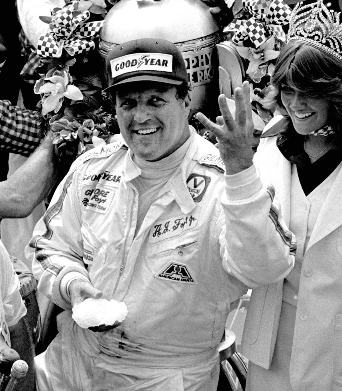 A.J. Foyt holds up four fingers in Victory Lane after winning his fourth Indianapolis 500 on May 29, 1977.