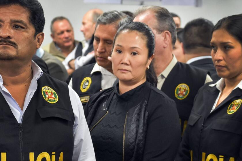 Handout picture released by the Peruvian Judiciary of opposition leader Keiko Fujimori (C), daughter of incarcerated former (1990-2000) Peruvian President Alberto Fujimori, during a court hearing in Lima on October 31, 2018. - Peru's powerful opposition leader Keiko Fujimori was taken into custody on Wednesday after a court ordered she be held in preventive detention for three years pending the outcome of a corruption probe. (Photo by HO / Peruvian Judiciary / AFP) / RESTRICTED TO EDITORIAL USE - MANDATORY CREDIT "AFP PHOTO / Peruvian Judiciary" - NO MARKETING NO ADVERTISING CAMPAIGNS - DISTRIBUTED AS A SERVICE TO CLIENTSHO/AFP/Getty Images ** OUTS - ELSENT, FPG, CM - OUTS * NM, PH, VA if sourced by CT, LA or MoD **