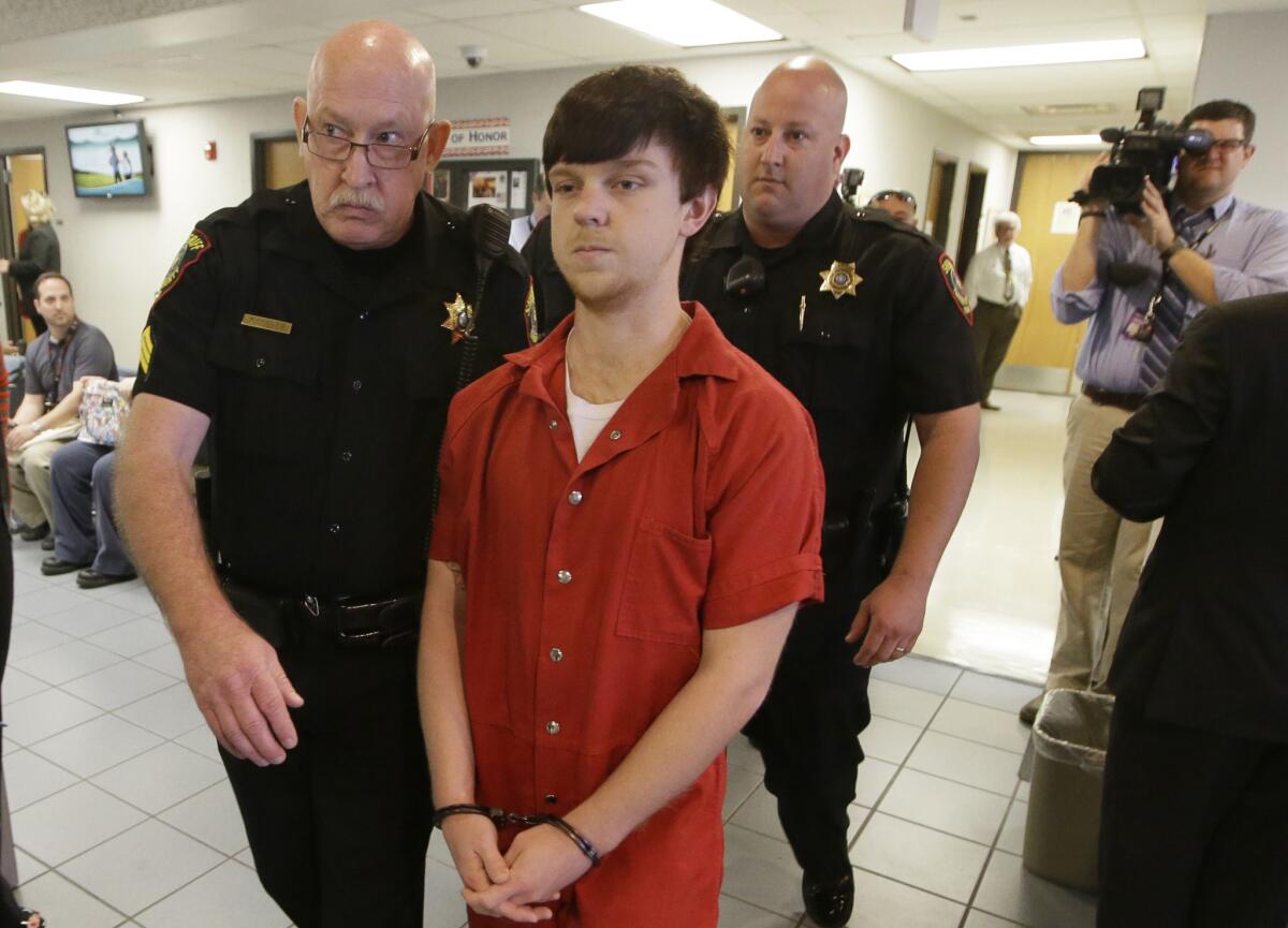 Ethan Couch is led to a juvenile court for a hearing on Friday in Fort Worth, Texas.