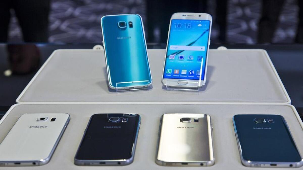 Samsung's Galaxy S6, top left, and Galaxy S6 Edge, top right.