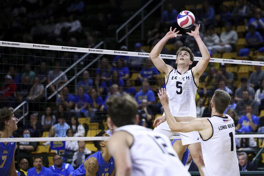 Long Beach State setter Aidan Knipe sets the ball during an NCAA men's volleyball game against UCLA 