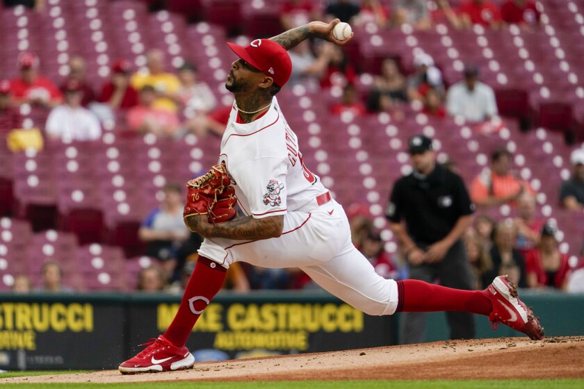 Reds starting pitcher Vladimir Gutierrez throws during the first inning of the team's baseball game against the Milwaukee Brewers in Cincinnati on Wednesday, June 9, 2021. (AP Photo/Jeff Dean)