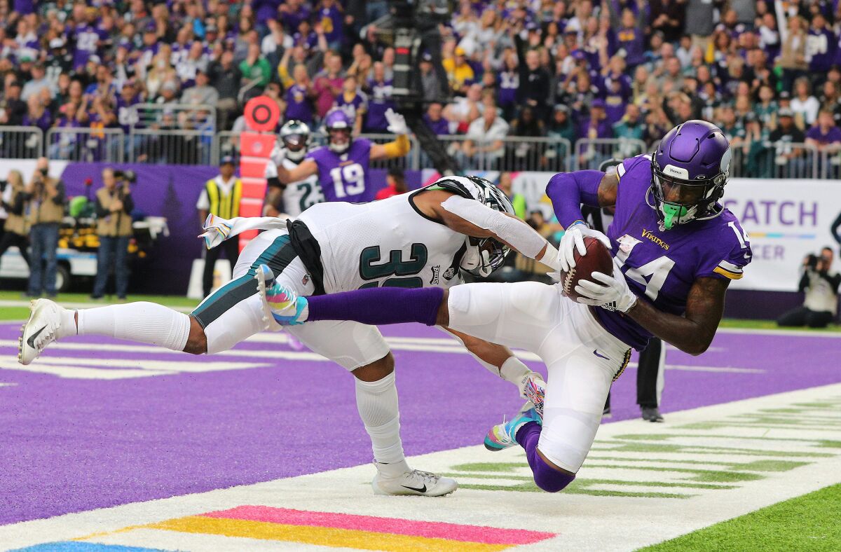 Minnesota Vikings wide receiver Stefon Diggs catches a touchdown pass in front of Philadelphia Eagles cornerback Craig James during the third quarter Sunday.
