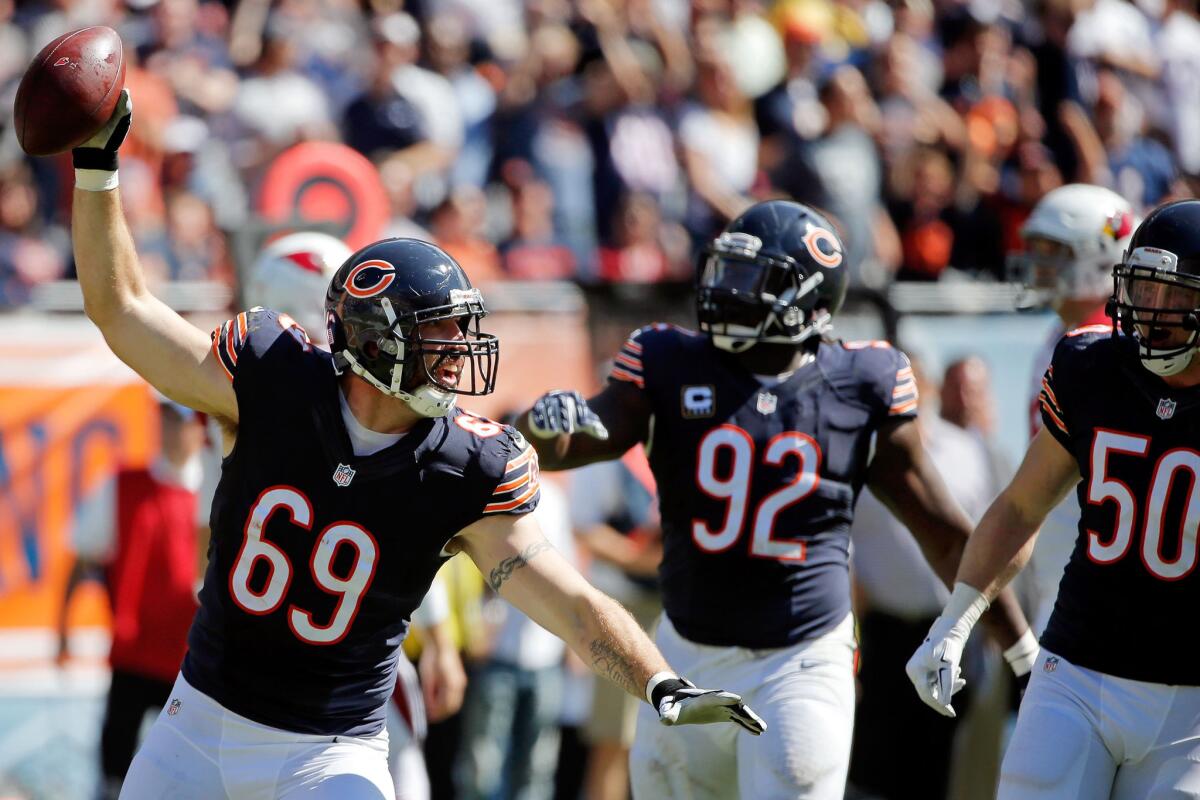 Bears defensive lineman Jared Allen celebrates after intercepting a pass against the Cardinals during a game on Sept. 20.