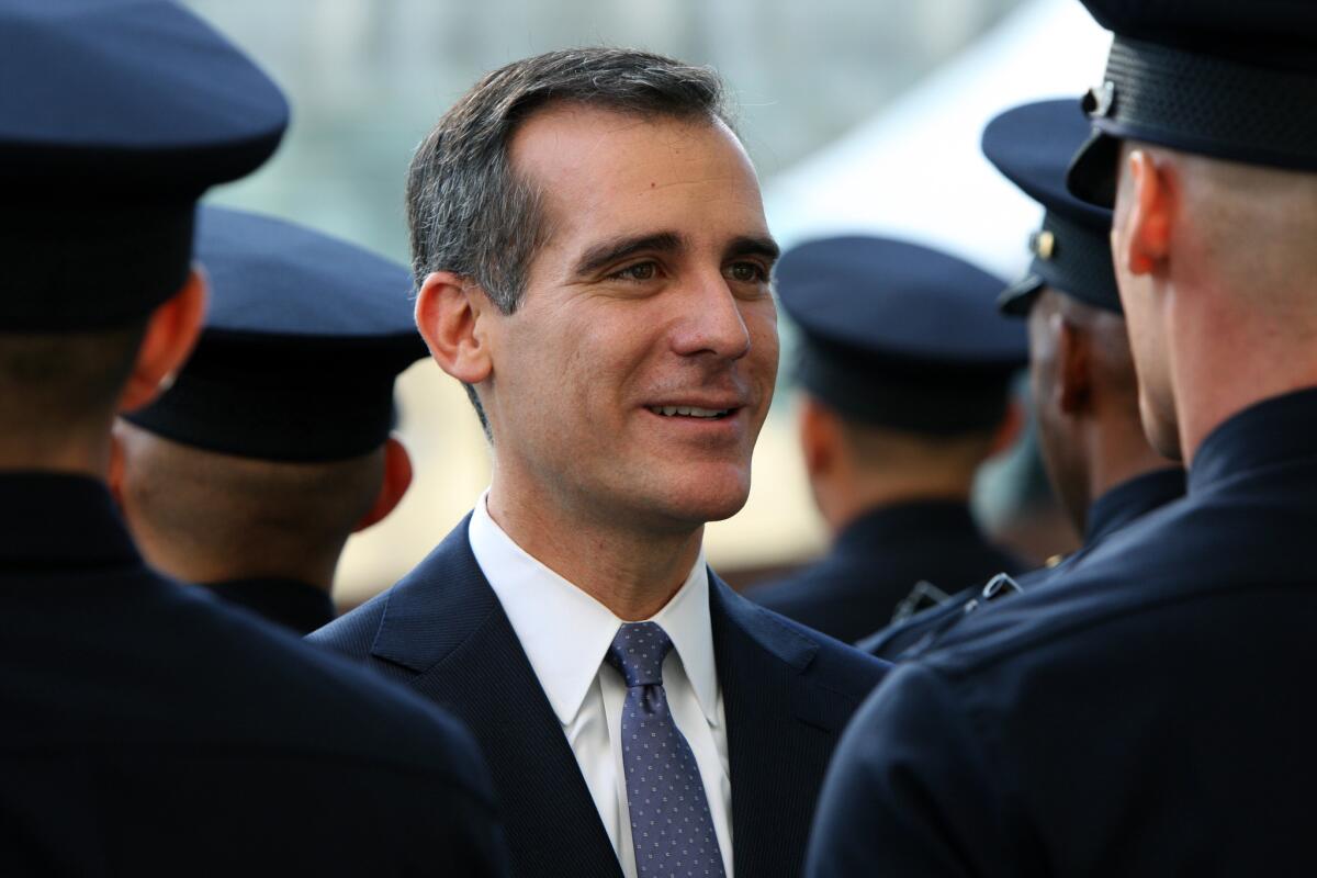 Los Angeles Mayor Eric Garcetti inspects a recruit class during a Police Academy graduation ceremony on Oct. 31, 2014, at LAPD headquarters.