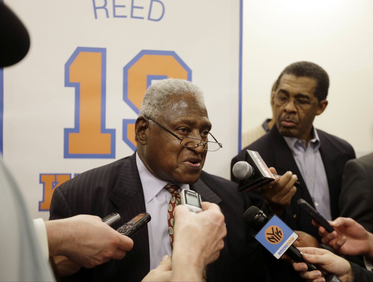 FILE - New York Knicks Hall-of-Famer Willis Reed responds to questions during an interview before an NBA basketball game between the Knicks and the Milwaukee Bucks, Friday, April 5, 2013, in New York. Willis Reed, who dramatically emerged from the locker room minutes before Game 7 of the 1970 NBA Finals to spark the New York Knicks to their first championship and create one of sports’ most enduring examples of playing through pain, died Tuesday, March 21, 2023. He was 80. Reed's death was announced by the National Basketball Retired Players Association, which confirmed it through his family. (AP Photo/Frank Franklin II, File)
