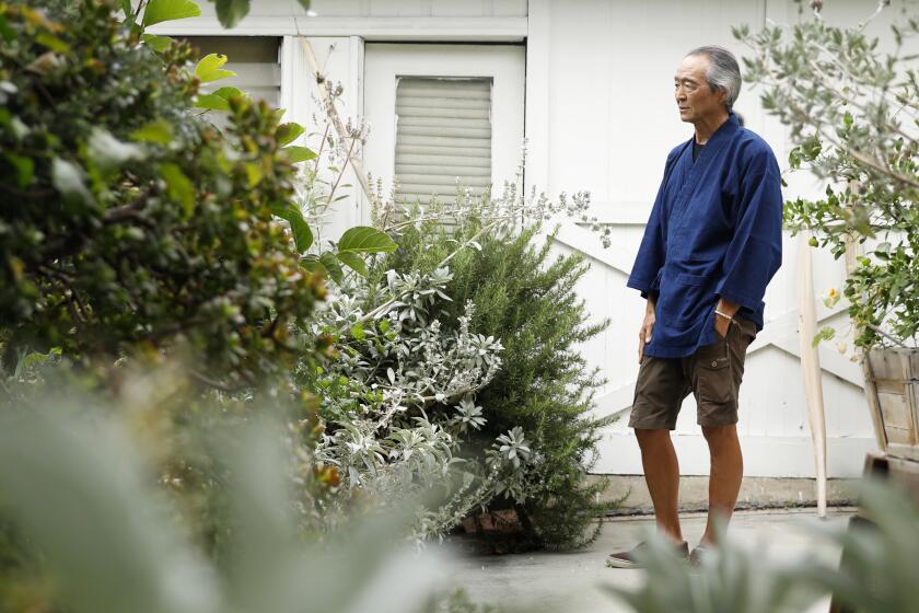 Georg Kochi is photographed at his Koreatown craftsman home.