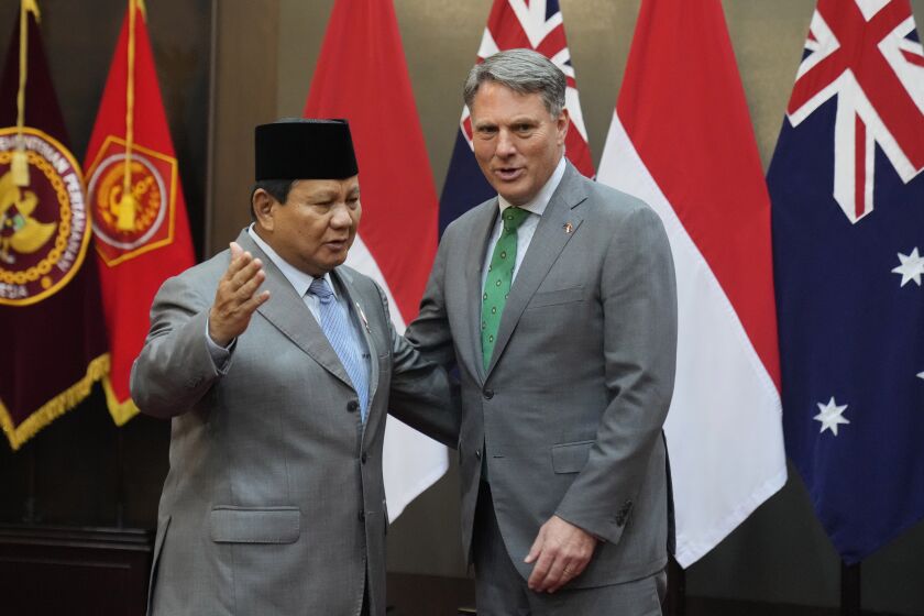 Australia's Deputy Prime Minister and Defense Minister Richard Marles, right, talks with Indonesian Defense Minister Prabowo Subianto during their meeting in Jakarta, Indonesia, Monday, June 5, 2023. (AP Photo/Dita Alangkara)