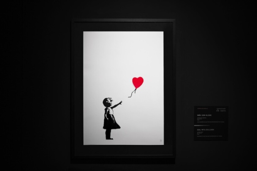 A screen print of a girl releasing a balloon shaped like a heart.   
