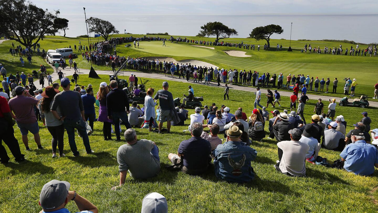 Fans watch Tigers Woods on the 5th hole of the Torrey Pines south course during the first round of the Farmers Insurance Open on Jan. 24, 2019. (Photo by K.C. Alfred/San Diego Union-Tribune)