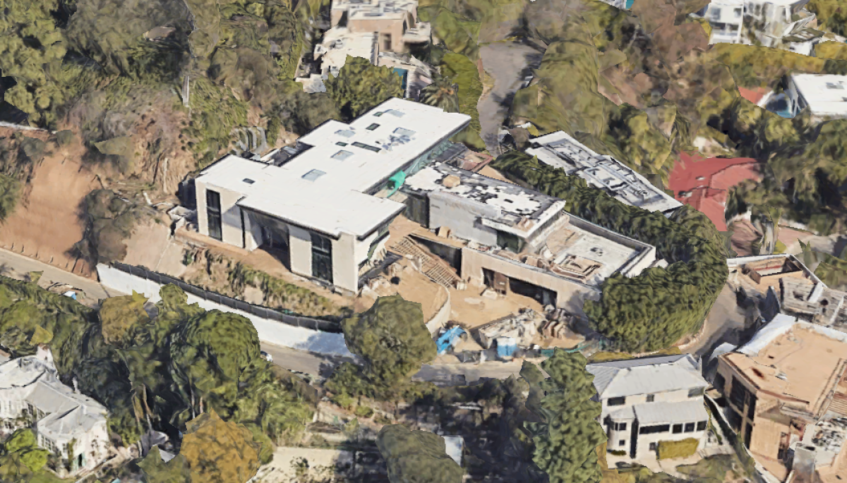 The three-story home sits on a knoll overlooking the Sunset Strip.