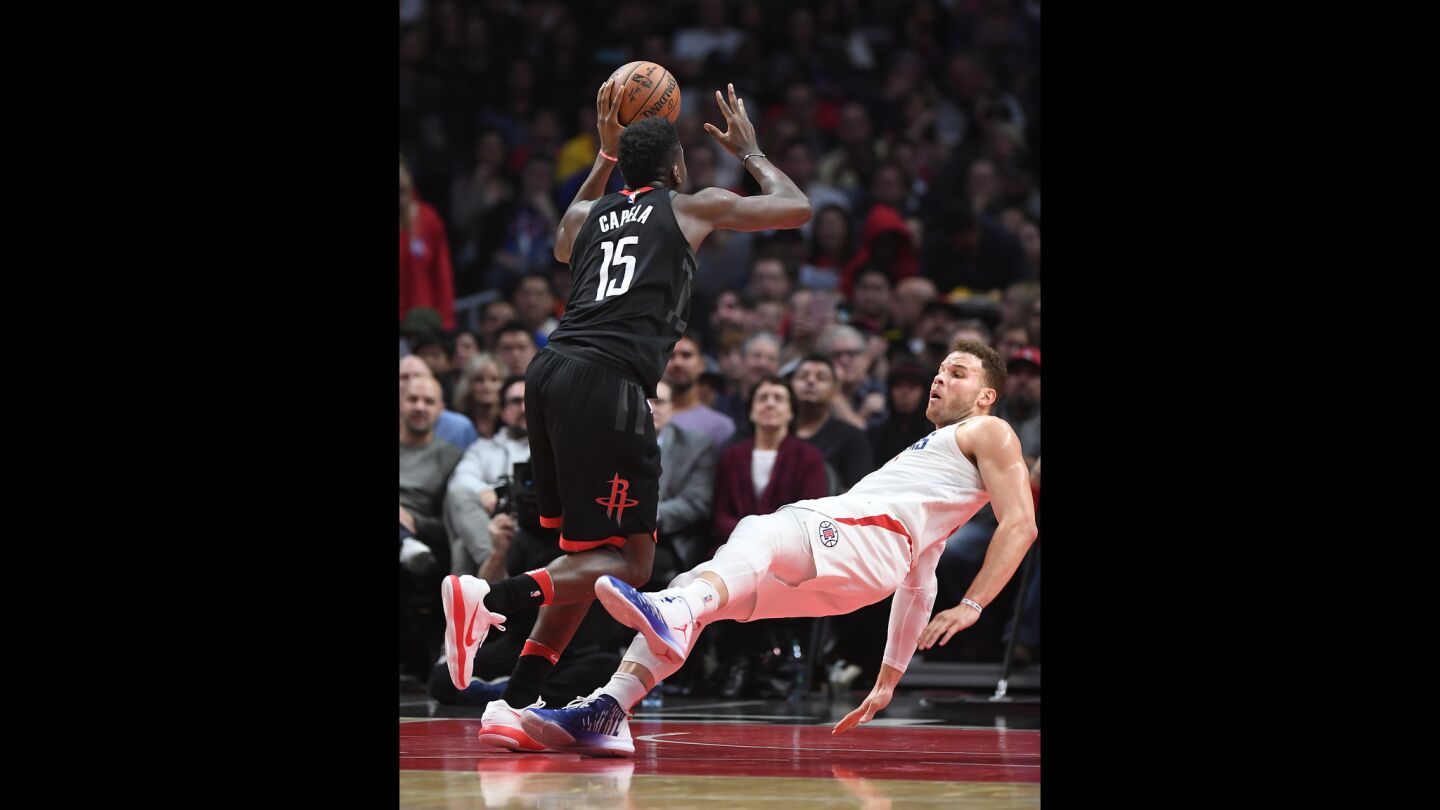 Clippers' Blake Griffin is called for a blocking foul as Houston Rockets' Clint Capela drives to the basket.