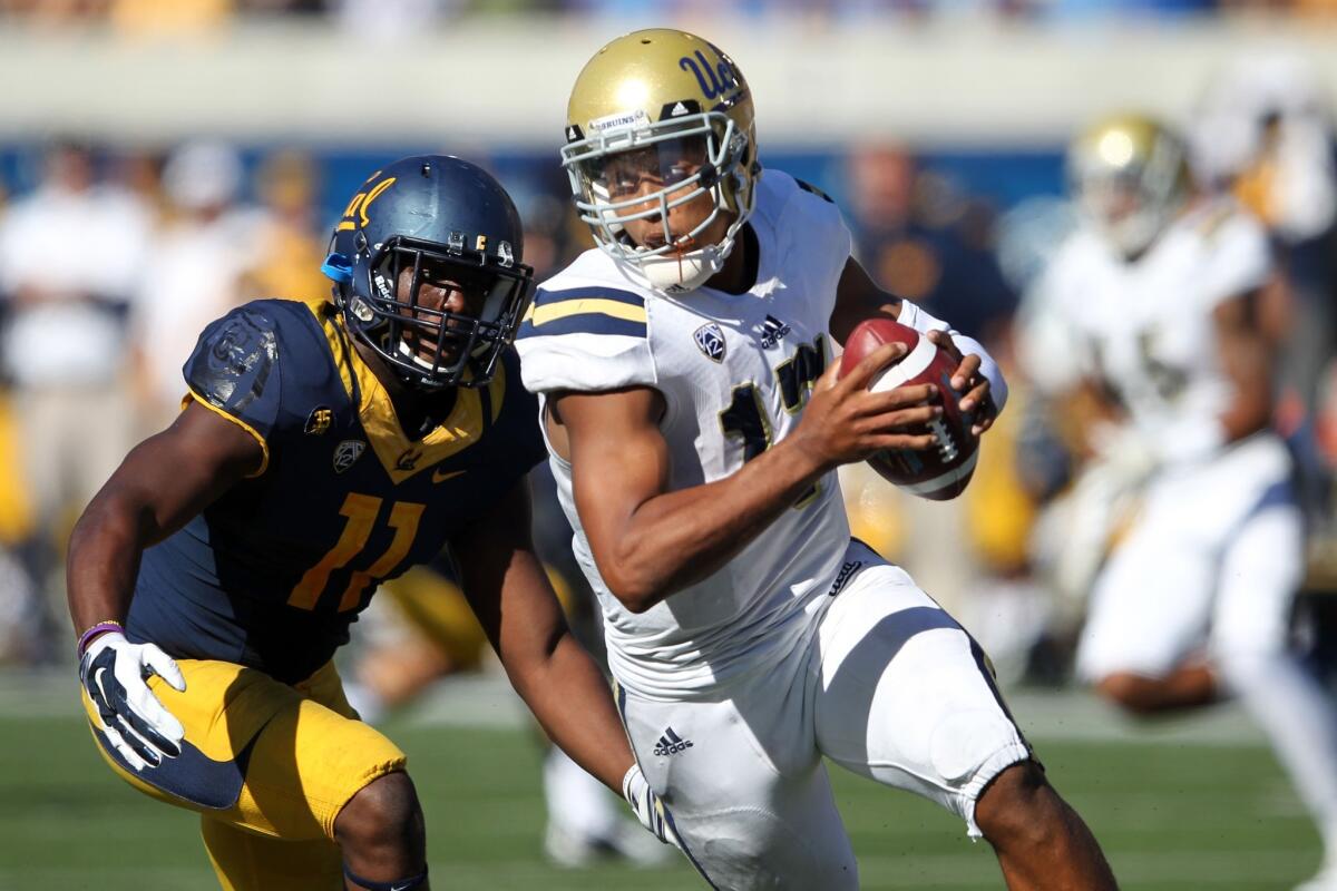 UCLA quarterback Brett Hundley is pursued by California defensive end Jonathan Johnson during a game on Oct. 18. The Bruins beat the Golden Bears, 36-34.