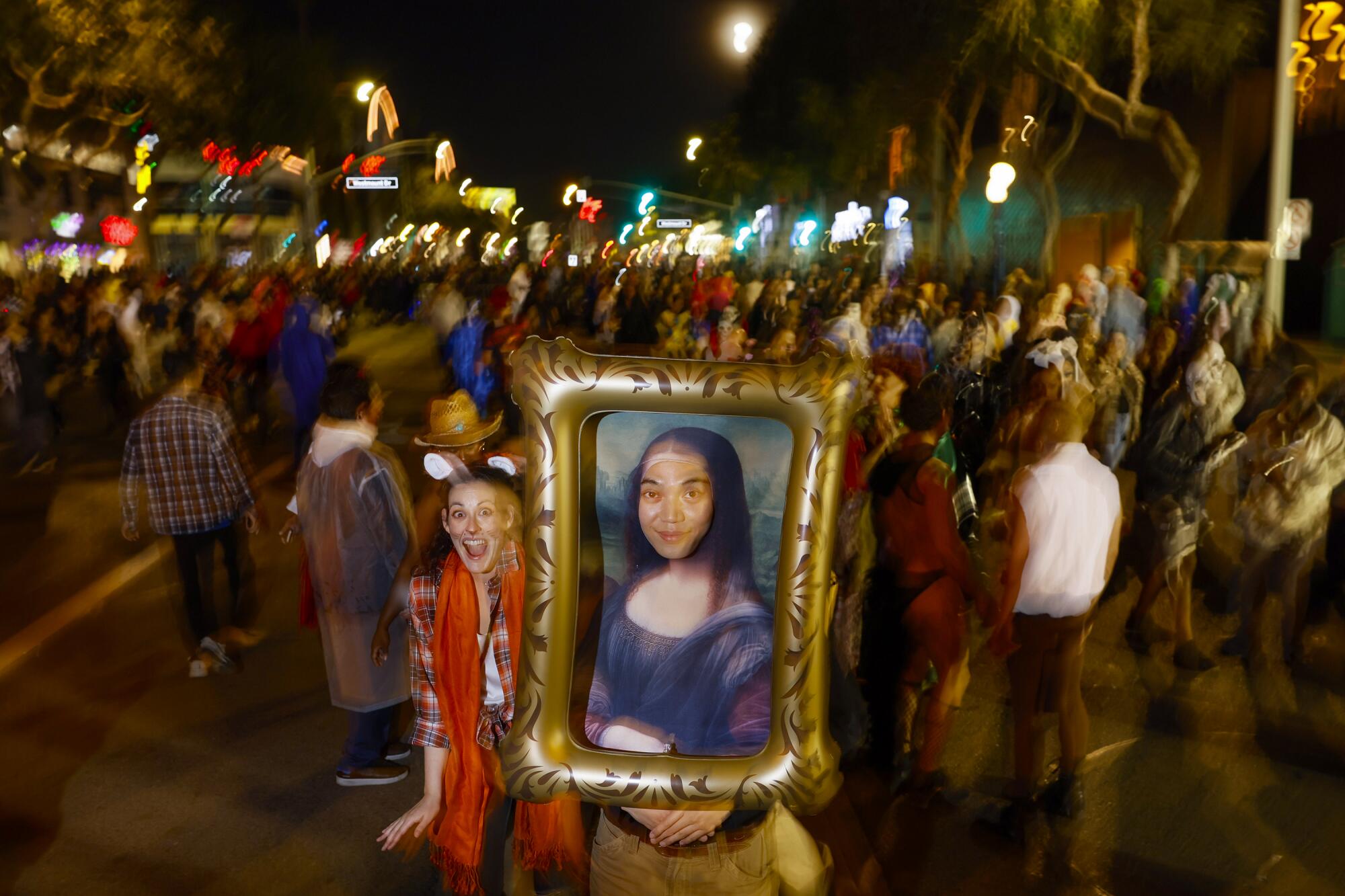 Kevin Phan is a piece of art as he walks along Santa Monica Blvd. at the West Hollywood Halloween Carnaval. 