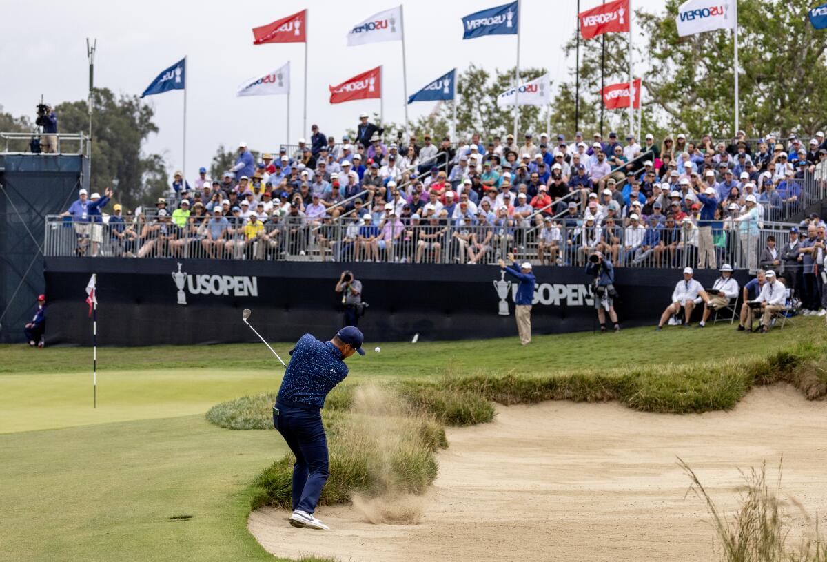  Jason Day hits out of a green-side bunker on the 8th hole during the first round of the U.S. Open.