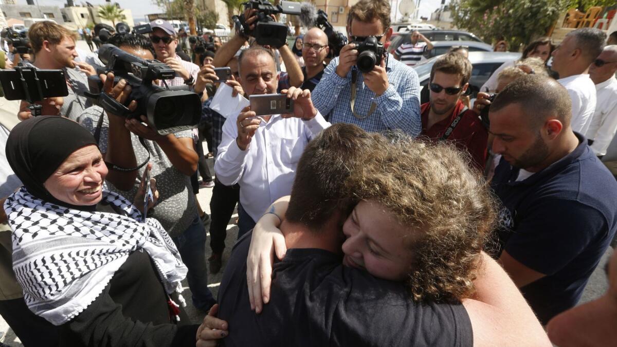 Ahed Tamimi is welcomed home in her village near the West Bank city of Ramallah.