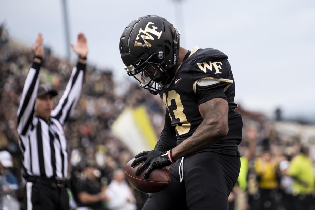 Wake Forest wide receiver Ke'Shawn Williams (13) celebrates a touchdown during the first half Oct. 30, 2021.