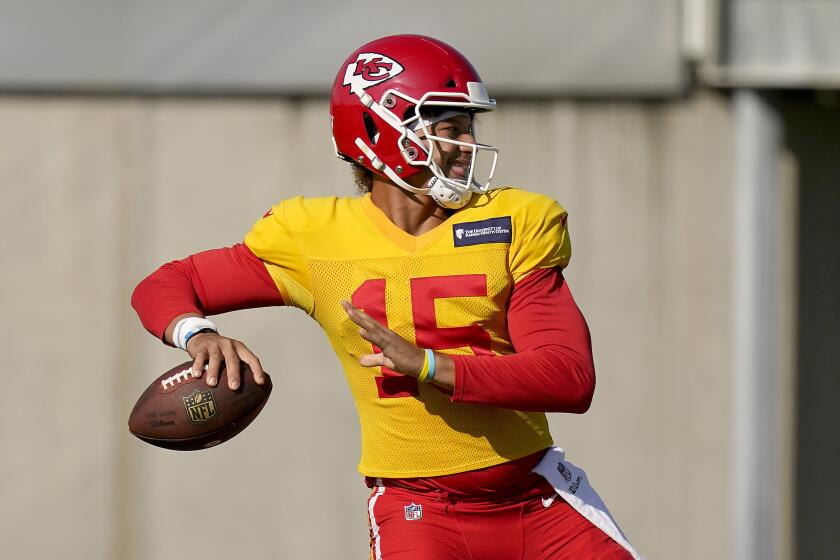 FILE - Kansas City Chiefs quarterback Patrick Mahomes throws a pass during NFL football training camp Friday, Aug. 21, 2020, in Kansas City, Mo. It has been a mere eight months since Patrick Mahomes led Kansas City from a 24-0 hole to beat Deshaun Watson and the Houston Texans in the divisional round of the playoffs, a brutally efficient comeback that ultimately propelled the Chiefs to their first Super Bowl title in 50 years. A whole lot has changed, though. (AP Photo/Charlie Riedel, File)