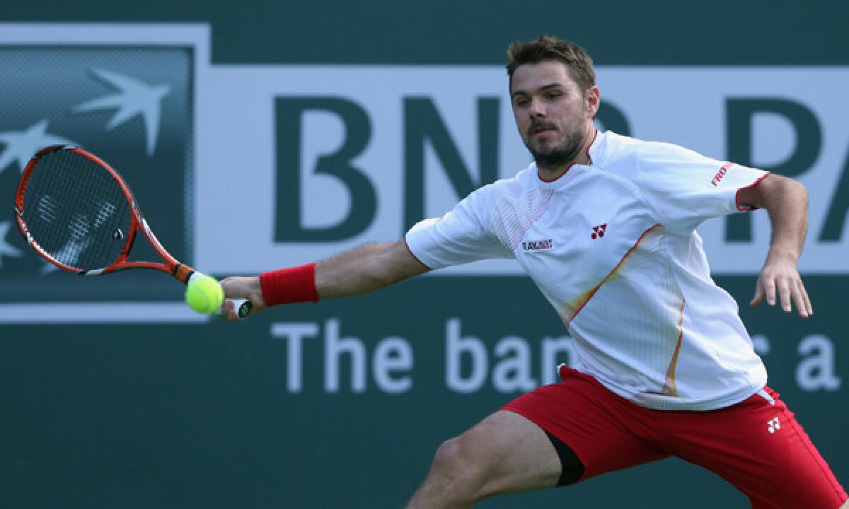 Stanislas Wawrinka lunges to return a shot during his win over Andreas Seppi at the BNP Paribas Open at Indian Wells on Monday.