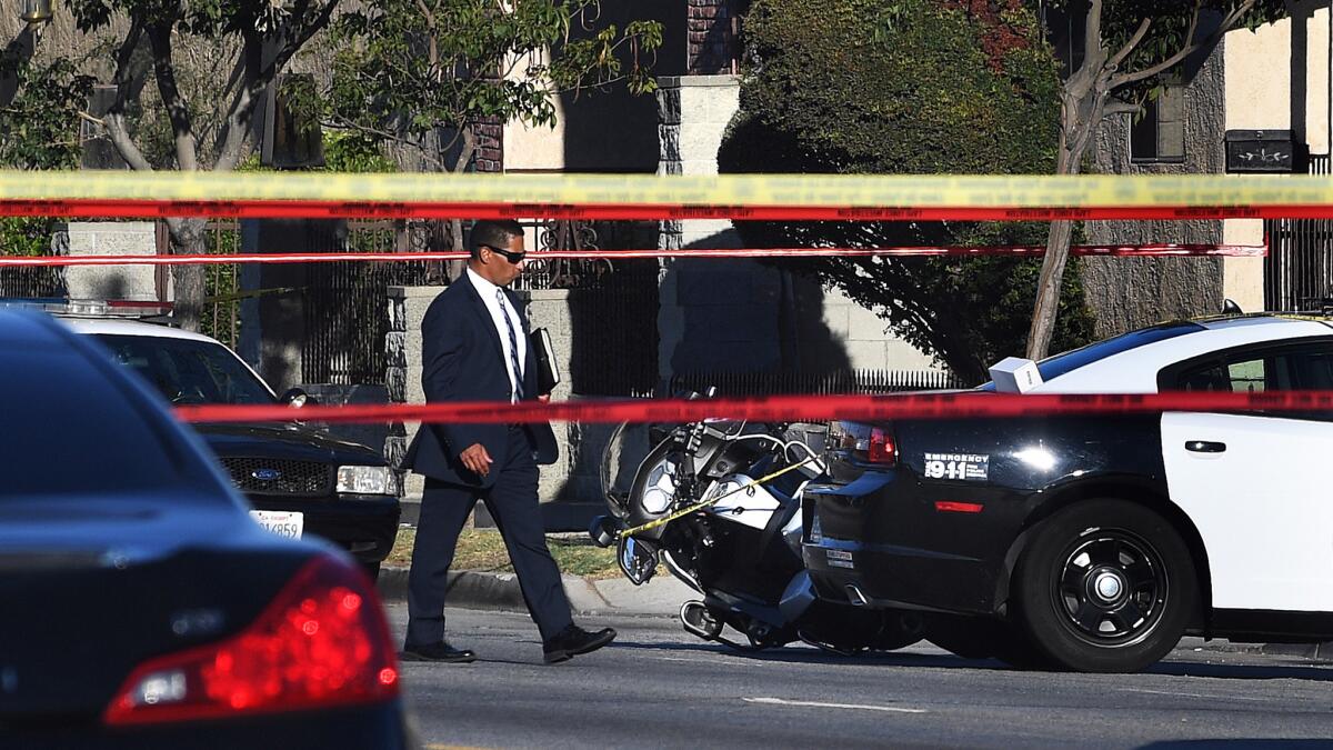 LAPD officials say a motorcycle officer shot and killed an 18-year-old, identified as Kenney Watkins, Tuesday afternoon following a traffic stop in South L.A.