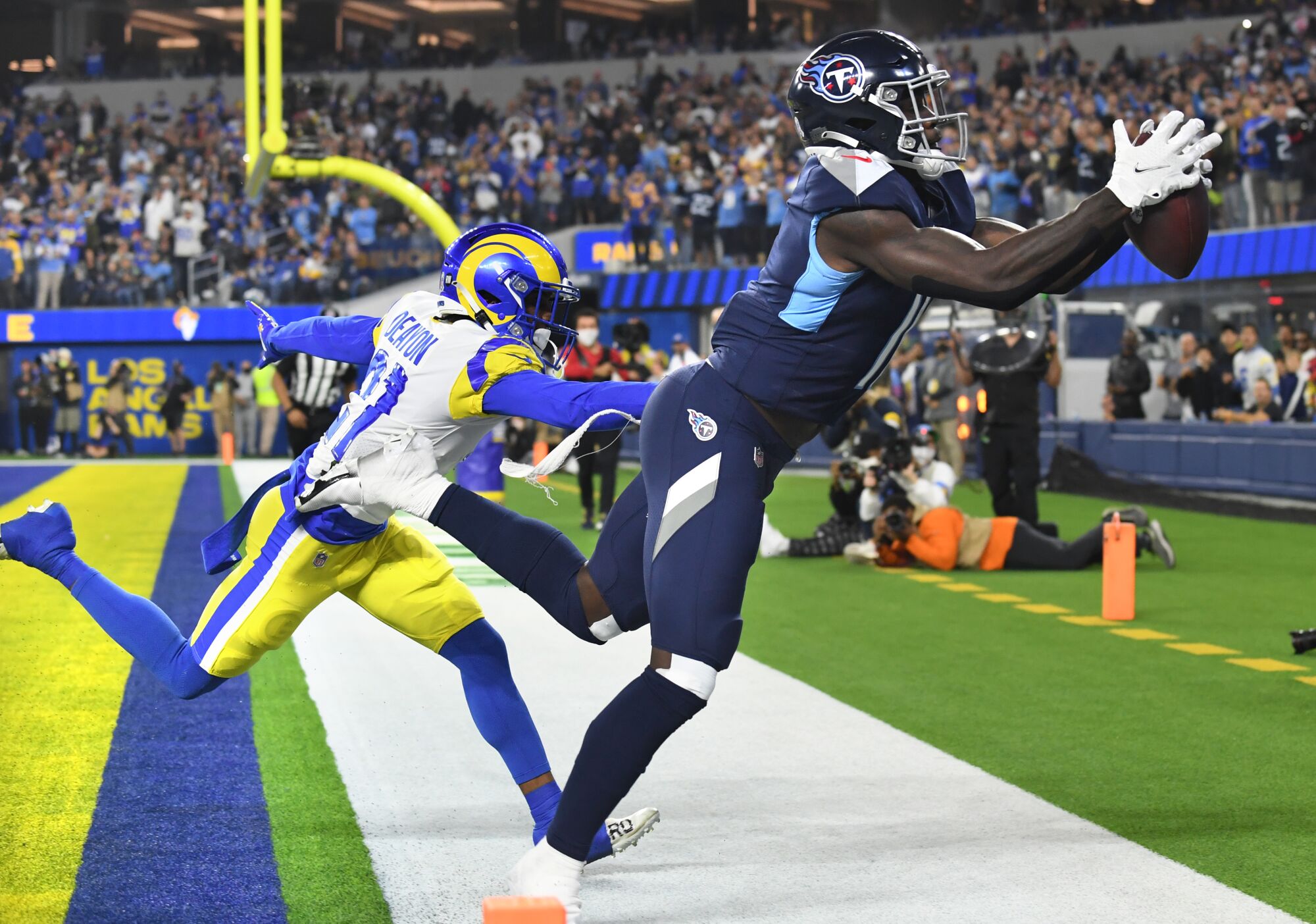 Titans receiver A.J. Brown makes a catch but is out of bounds in the end zone as Rams cornerback Dont'e Deayon defends.