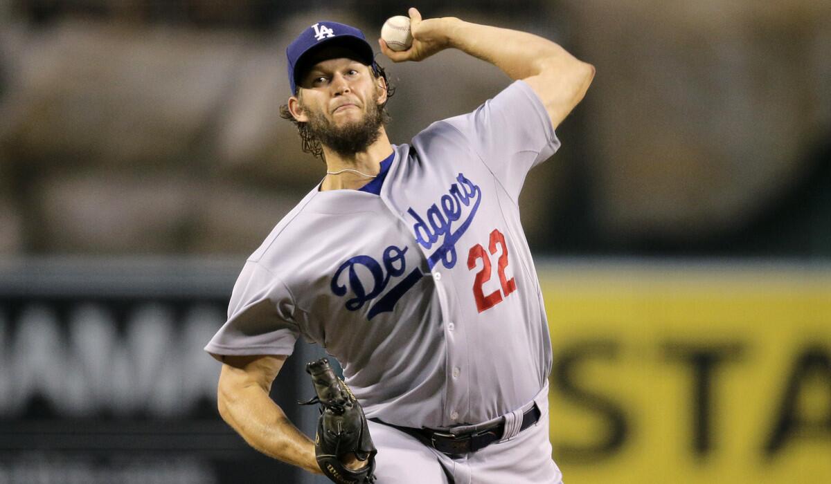 Dodgers starting pitcher Clayton Kershaw throws against the Angels during the first inning on Tuesday.