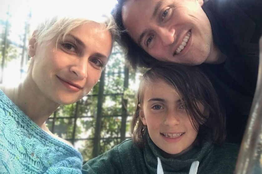 Photo of cinematographer Halyna Hutchins with husband Matthew Hutchins and their son, Andros Hutchins. Hutchins' surviving family today filed suit against Alec Baldwin and other producers.