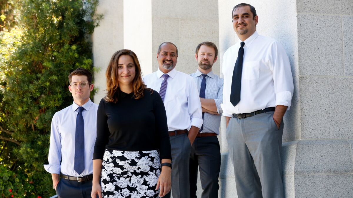 State Senate counsel Jake Levine, left, Jena Price of the California League of Conservation Voters, Parin Shah of the Asian Pacific Environmental Network, Alex Jackson of the Natural Resources Defense Council and Assembly aide Carlos Gonzalez worked on the climate measure. (Gary Coronado / Los Angeles Times)
