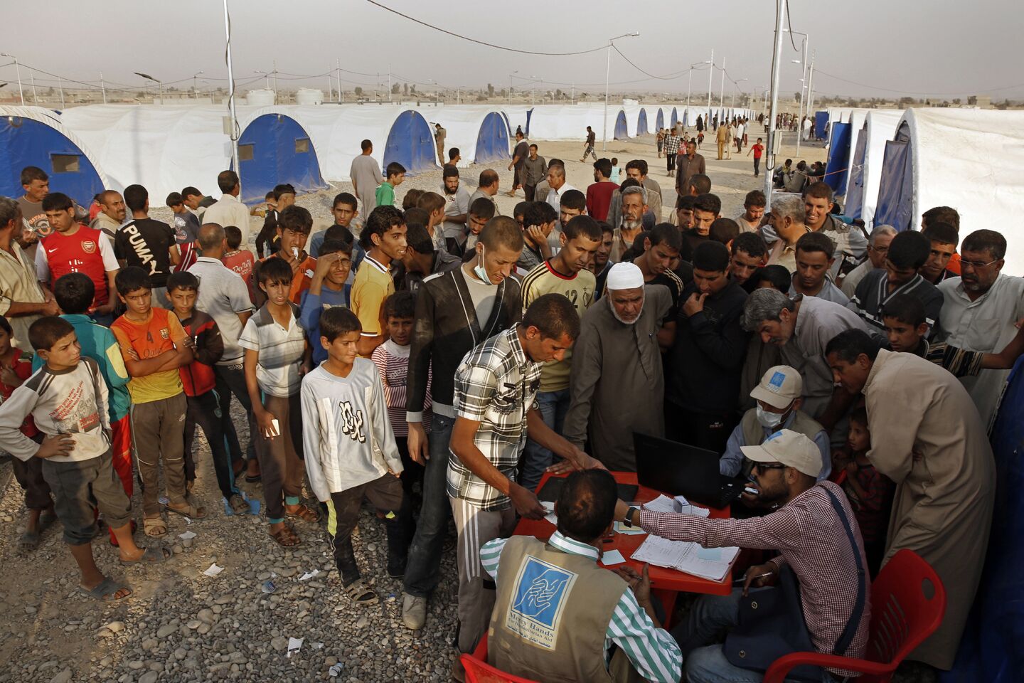 As many Iraqis are returning home, others are fleeing the fighting in villages surrounding Mosul. At Camp JJadh, 3,000 people arrived in the past week, but many more are expected as the battle for Mosul continues. New arrivals line up for food, provide by the World Food Program.