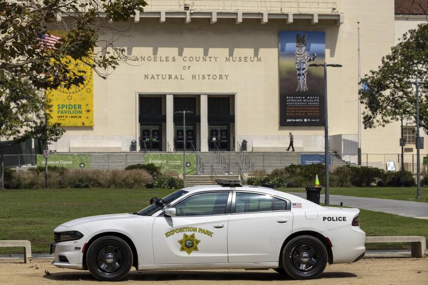Los Angeles, CA - September 14: Exposition Park police patrol through Exposition Park, past the Los Angeles County Museum of Natural History in Los Angeles Thursday, Sept. 14, 2023. (Allen J. Schaben / Los Angeles Times)