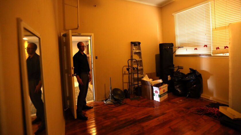 Bob Daignault of the Apartment Assn. of Greater Los Angeles looks over a vacant "bootlegged" apartment unit in 2015.
