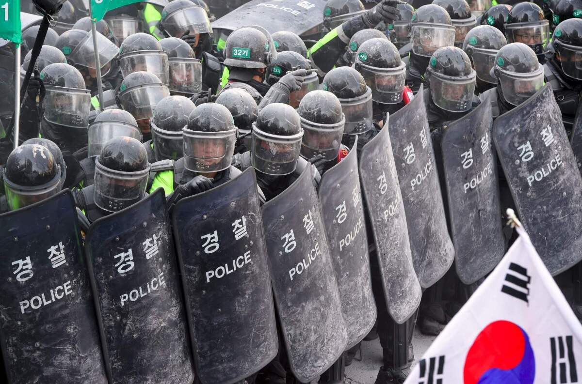 South Korean supporters of Park Geun-Hye clash with police after the announcement of the Constitutional Court to uphold the impeachment of President Park on March 10, 2017. The rival crowds epitomized the opposing passions and generational splits over the country's sweeping political scandal.