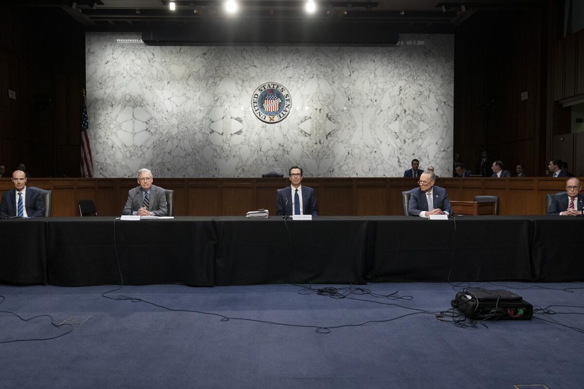 Socially distanced, Labor Secretary Eugene Scalia, left, Senate Majority Leader Mitch McConnell (R-Ky.), Treasury Secretary Steven T. Mnuchin, Senate Minority Leader Charles E. Schumer (D-N.Y.) and National Economic Council Director Larry Kudlow attend a negotiation session about a next-step economic bailout on Friday.