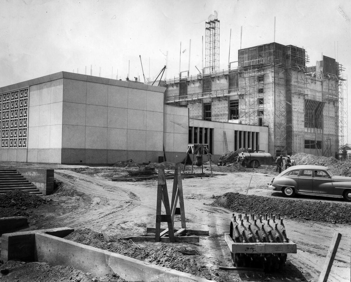 Aug. 14, 1953: East wing of Mormon Temple under construction on Santa Monica Boulevard at Selby Avenue. Work is prodeeding on main structure in background. It has already risen 72 of its 110 feet and will be topped by a 147-foot tower.
