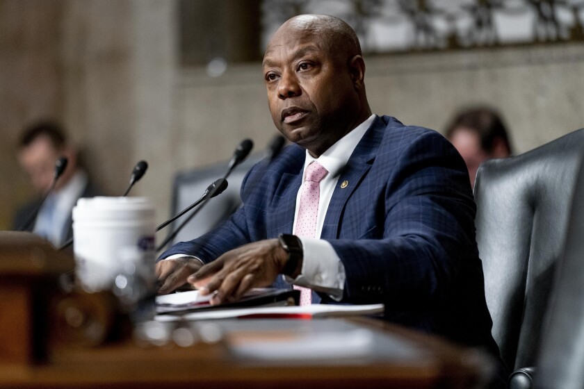 FILE - Sen. Tim Scott, R-S.C., speaks during a Senate Banking Committee hearing on Capitol Hill in Washington, Nov. 30, 2021. The U.S. Senate’s only Black Republican is putting forth what he characterizes as a positive response to partisan rhetoric on race that he’s best-positioned to rebut. Tim Scott of South Carolina tells The Associated Press that he hopes a video series on issues he sees as pertinent to the Black community will help refocus a fraught national conversation on race. Scott has timed the release in conjunction with Martin Luther King Jr. Day. (AP Photo/Andrew Harnik, File)