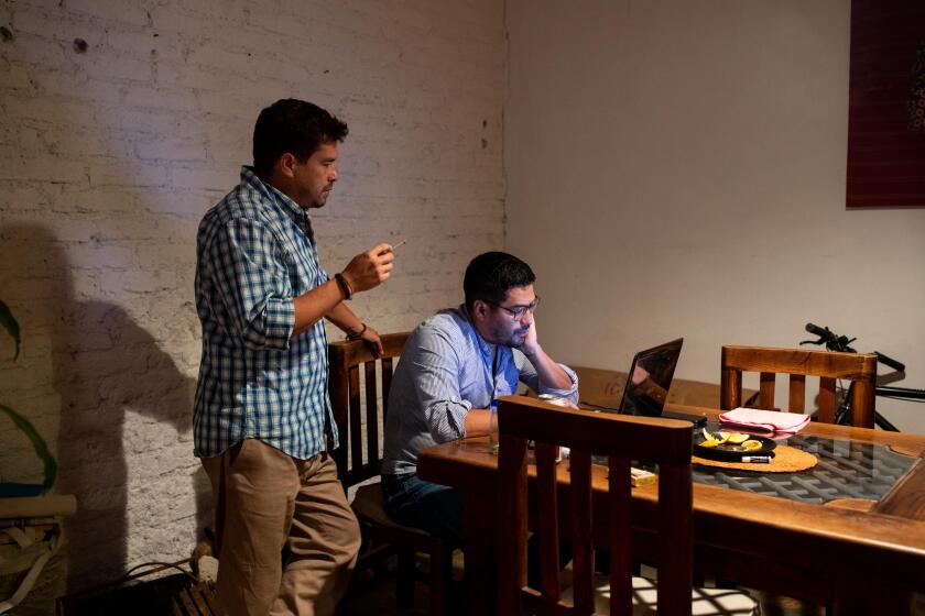 MEXICO CITY - May 17, 2022 - Brothers Oscar and Carlos Martinez of the publication El Faro, on the day they publish their story about President Buckle and his ties to organized crime in El Salvador. (Lisette Poole / for The Times)