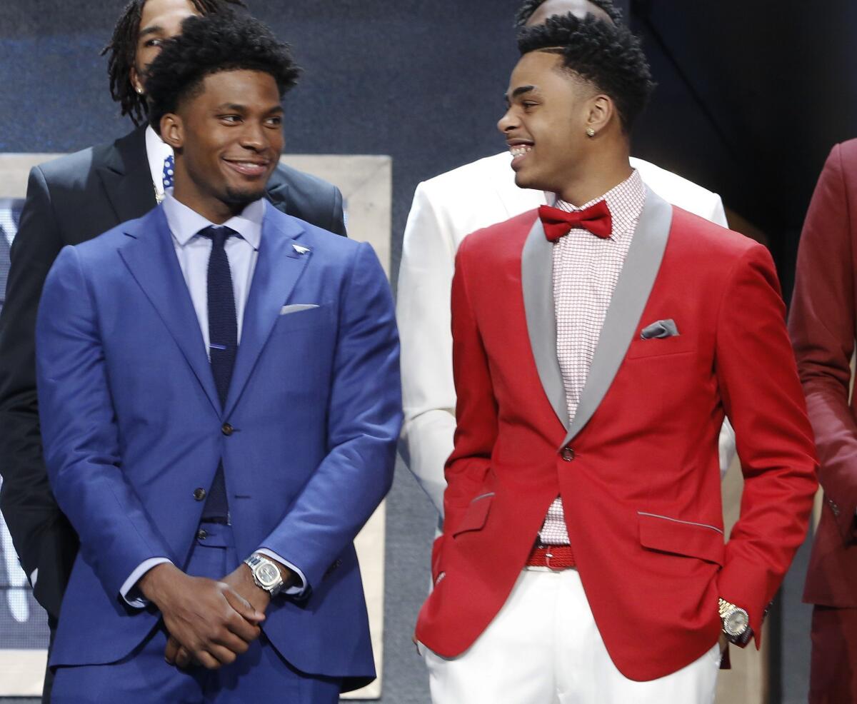 Justise Winslow, left, and D'Angelo Russell talk during photo session before the NBA basketball draft, Thursday, June 25, 2015, in New York.