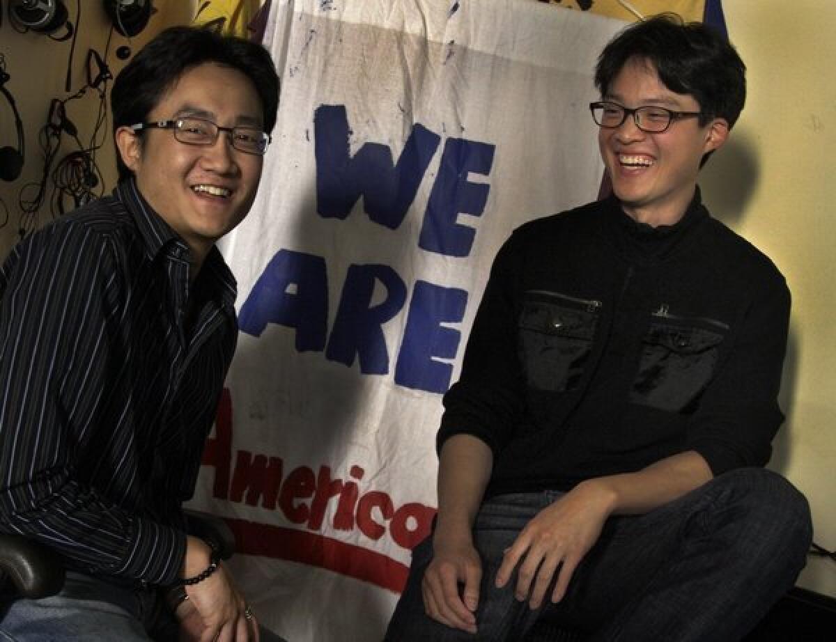 Kevin Lee, right, with friend Geun Joo An at the Korean Resource Center in Los Angeles. Kevin Lee discovered in his late teens that he was an illegal immigrant. (Photo