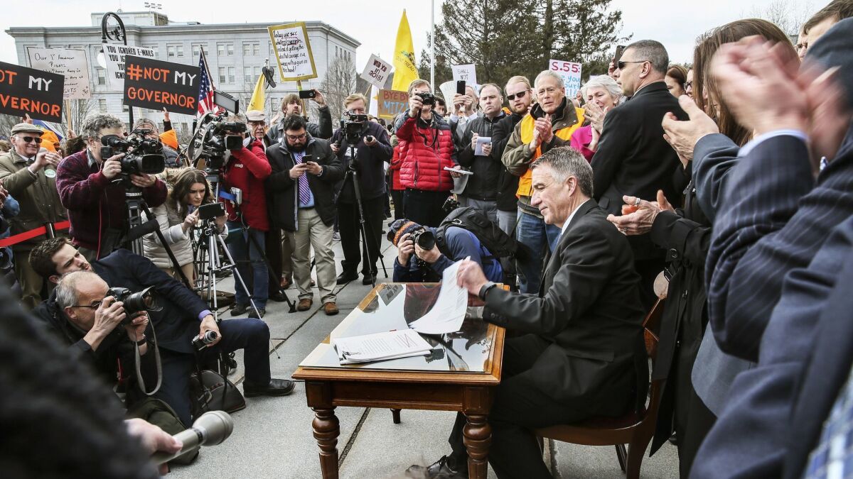 Vermont Gov. Phil Scott signs the first significant gun control bills in the state's history on Wednesday.
