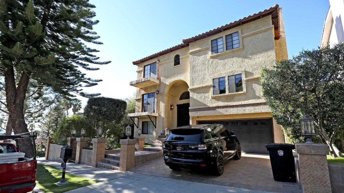 The home at 512 S. Via Montana in Burbank, along with a home in La Crescenta and another in La Cañada Flintridge, was raided by the FBI on Wednesday.