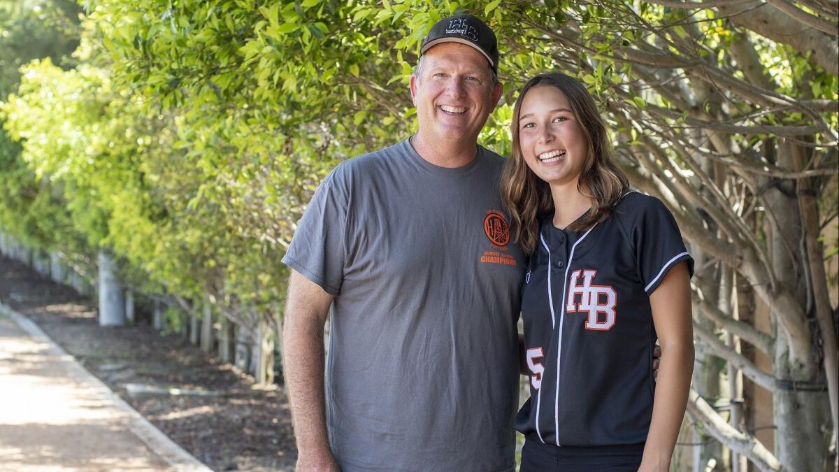 Jeff Forsberg, left, with the help of Kelli Kufta, right, guided Huntington Beach High to a share of the Sunset League title and the program's first trip to the quarterfinals of the CIF Southern Section playoffs.