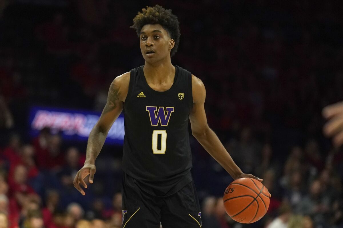 Washington forward Jaden McDaniels brings the ball up court during a game against Arizona on March 7, 2020, in Tucson.