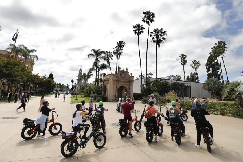 San Diego CA - June 15: People take a electric bike tour through Balboa Park on a partly cloudy day on Thursday, June 15, 2023. (K.C. Alfred / The San Diego Union-Tribune)