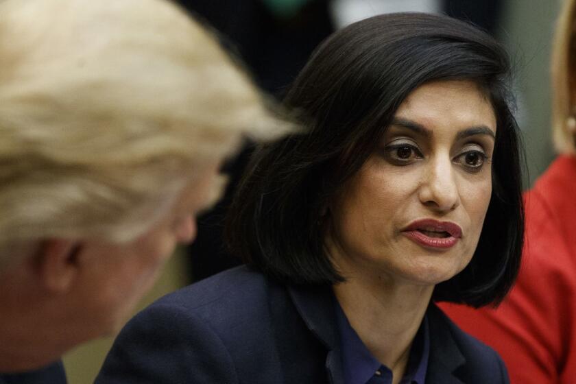 FILE - In this March 22, 2017, file photo President Donald Trump , left, and Texas State Sen. Dawn Buckingham, right, listen as Administrator of the Centers for Medicare and Medicaid Services Seema Verma speaks during a meeting on women in healthcare in the Roosevelt Room of the White House in Washington. Verma is slamming ???Medicare for All,??? the proposal from Vermont Democratic Sen. Bernie Sanders for a national health care plan that would cover all Americans. (AP Photo/Evan Vucci, File)